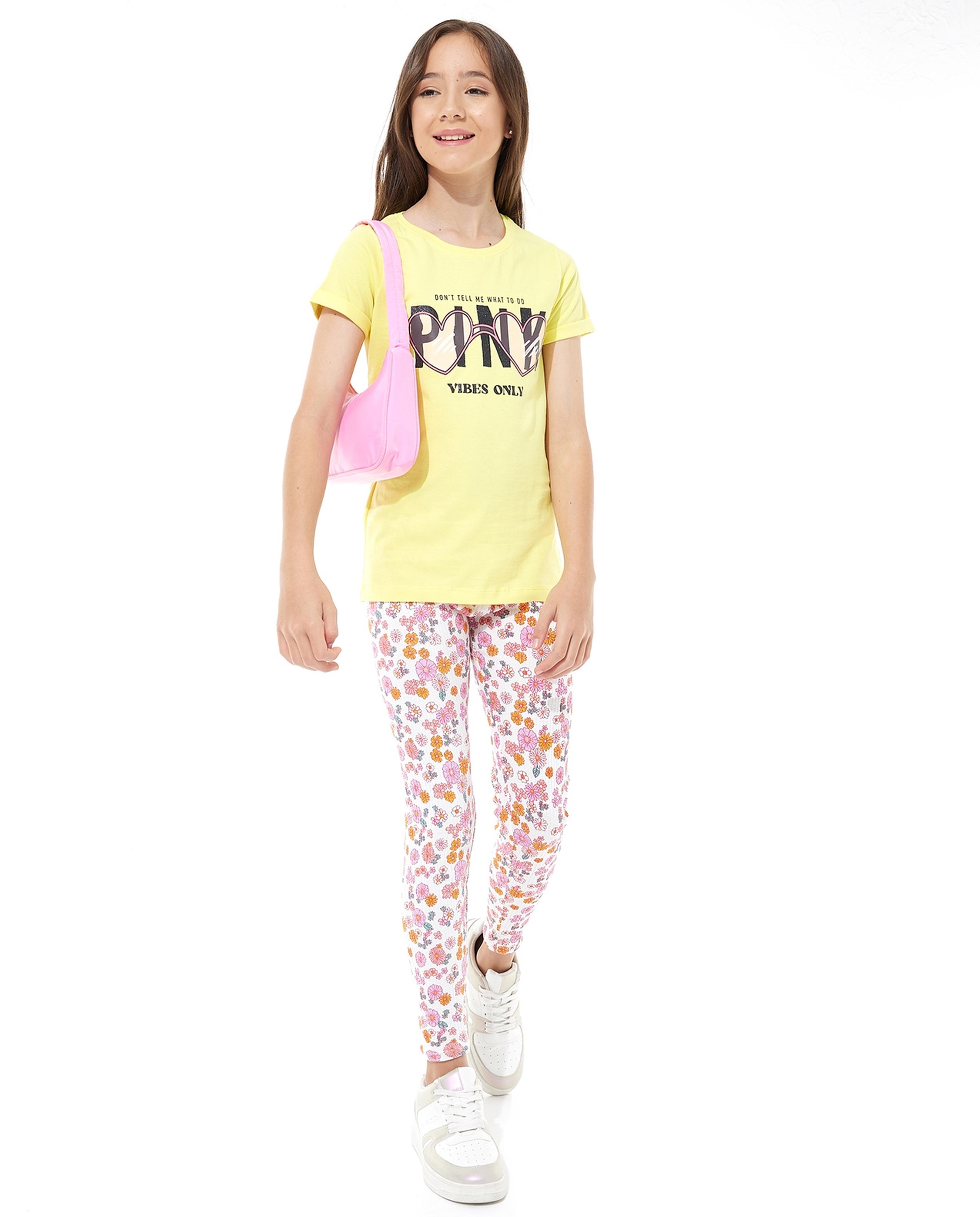 تيشيرت بأكمام طويلة ورقبة مستديرة بطبعة جرافيك