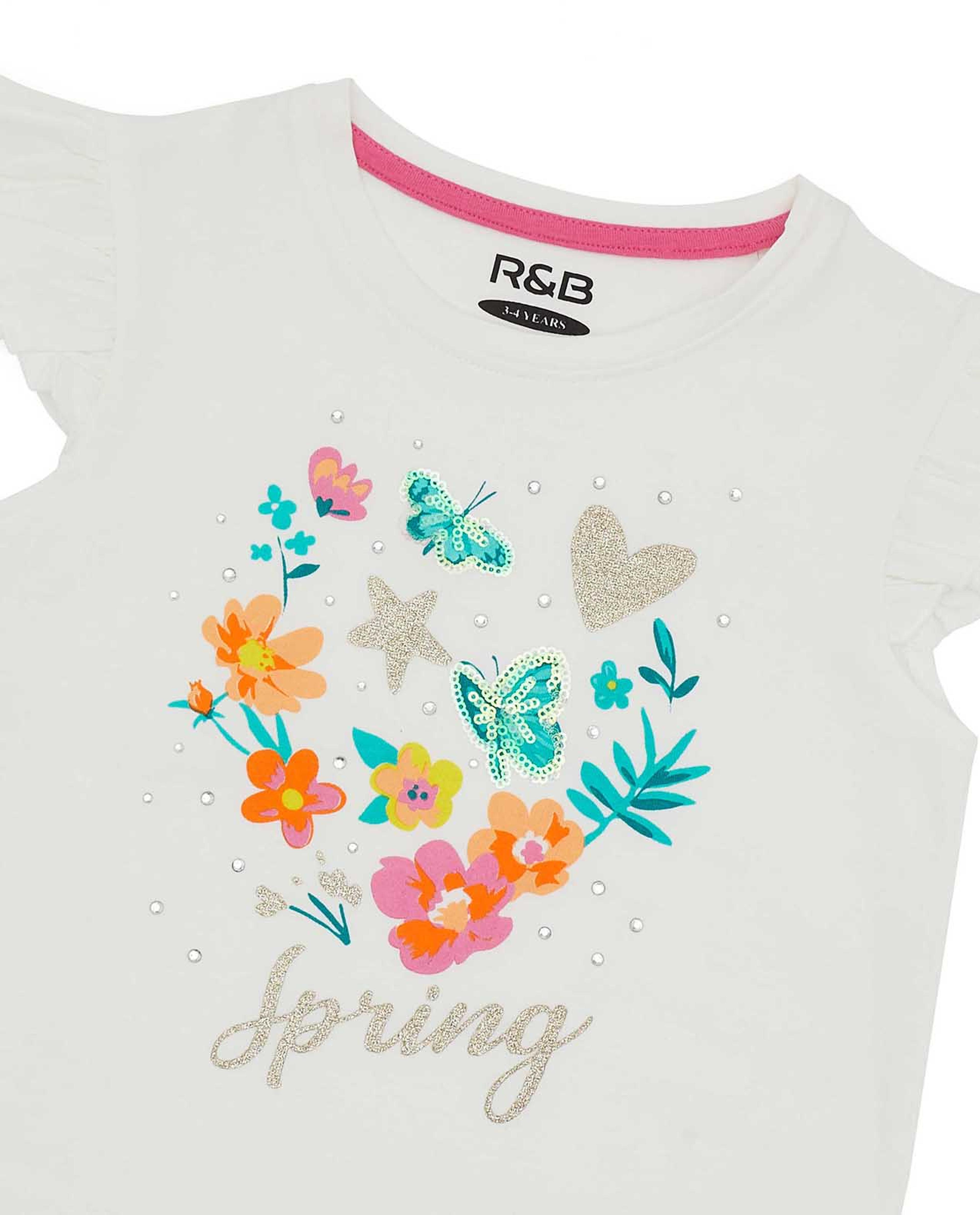 تيشيرت برقبة دائرية وأكمام مكشكشة بطبعة