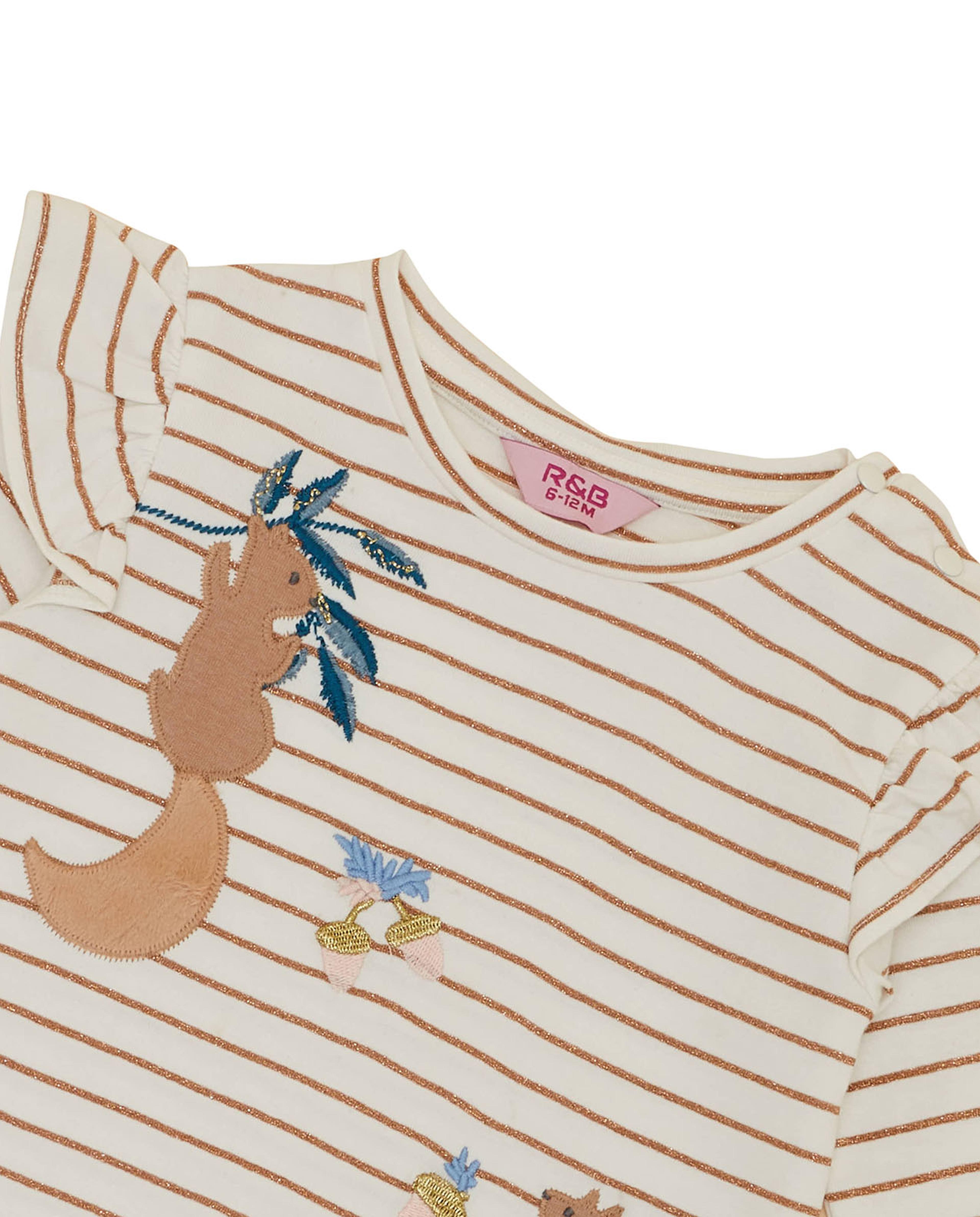 توب مطرز بأكمام طويلة