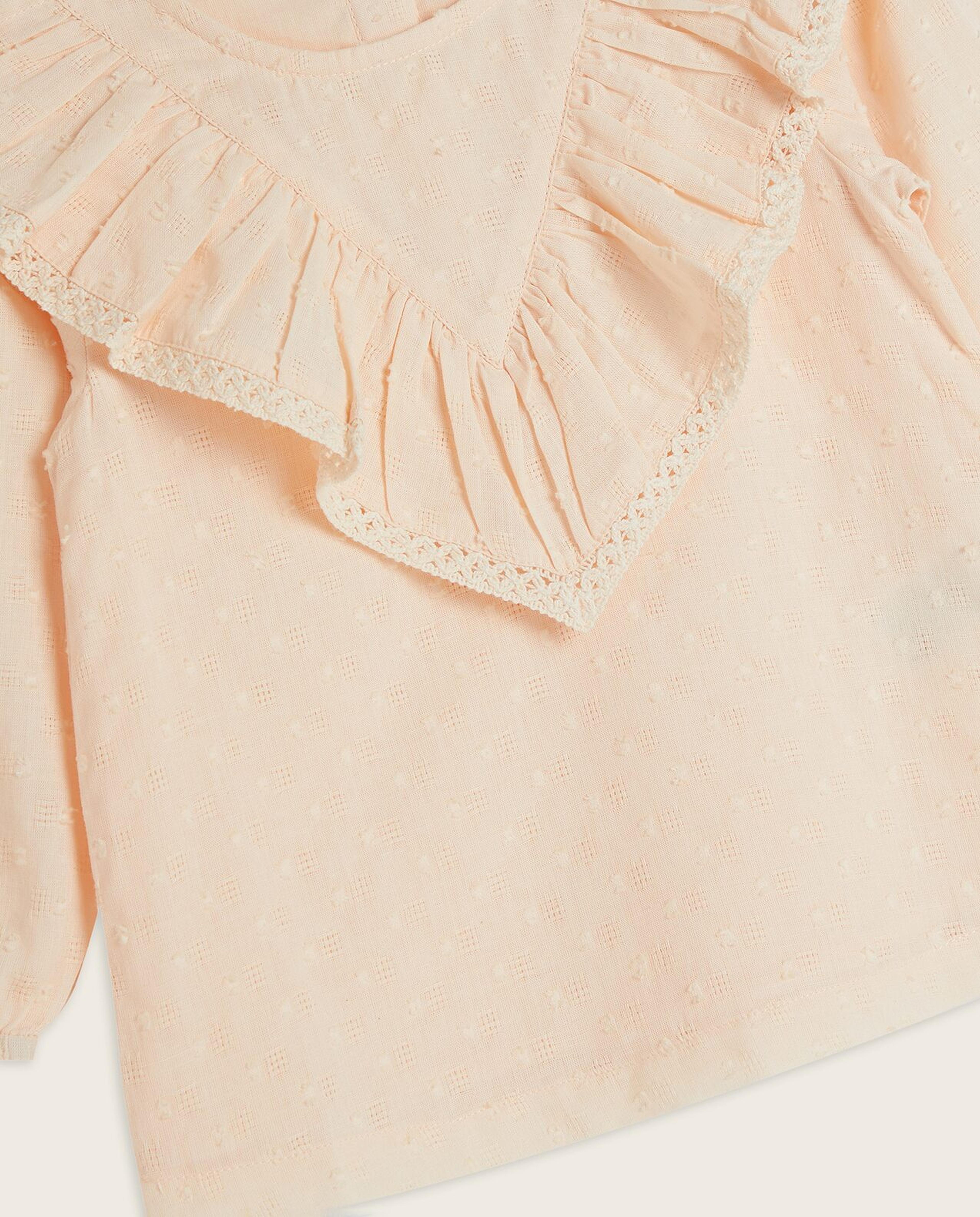 توب بياقة دائرية وأكمام طويلة