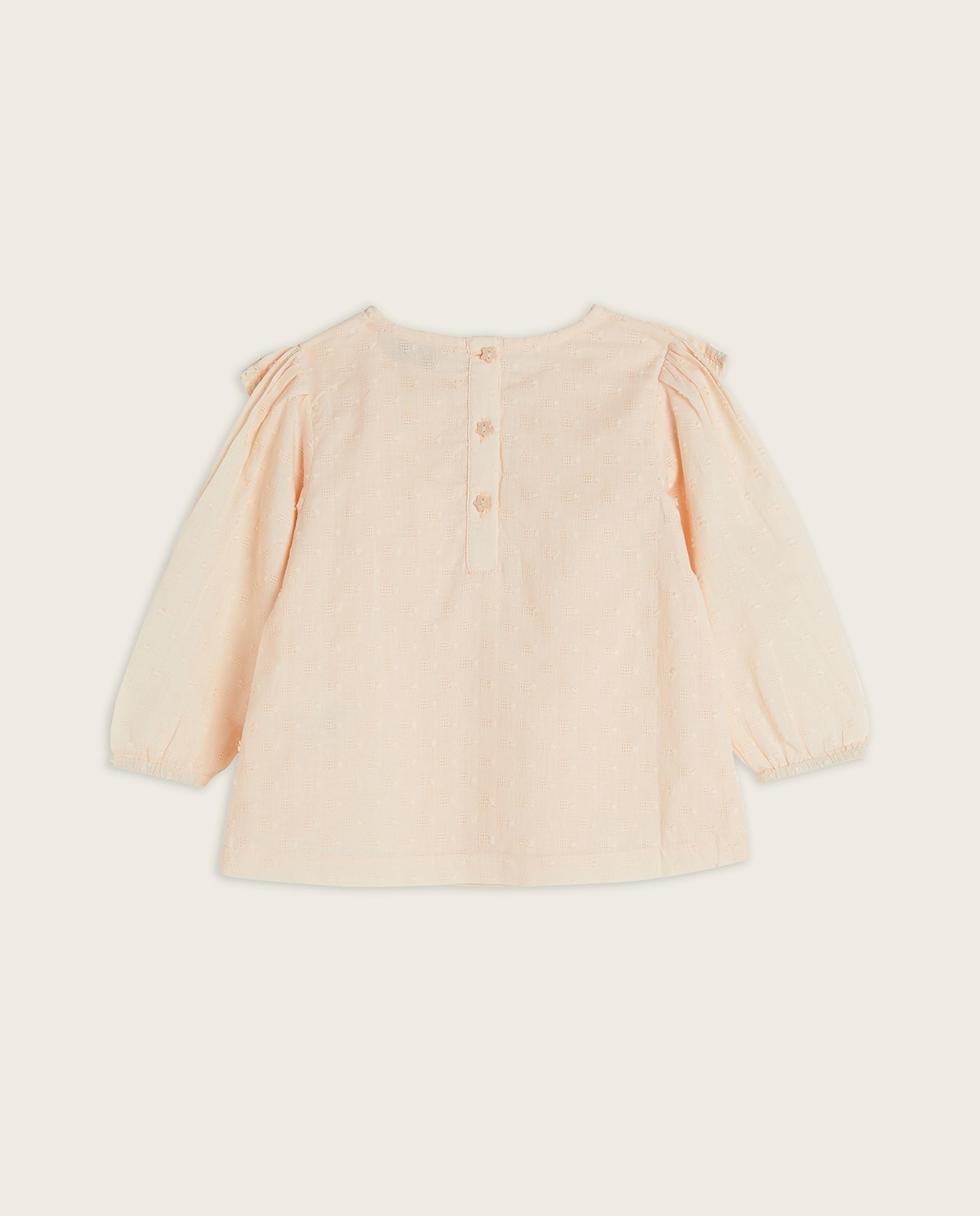 توب بياقة دائرية وأكمام طويلة