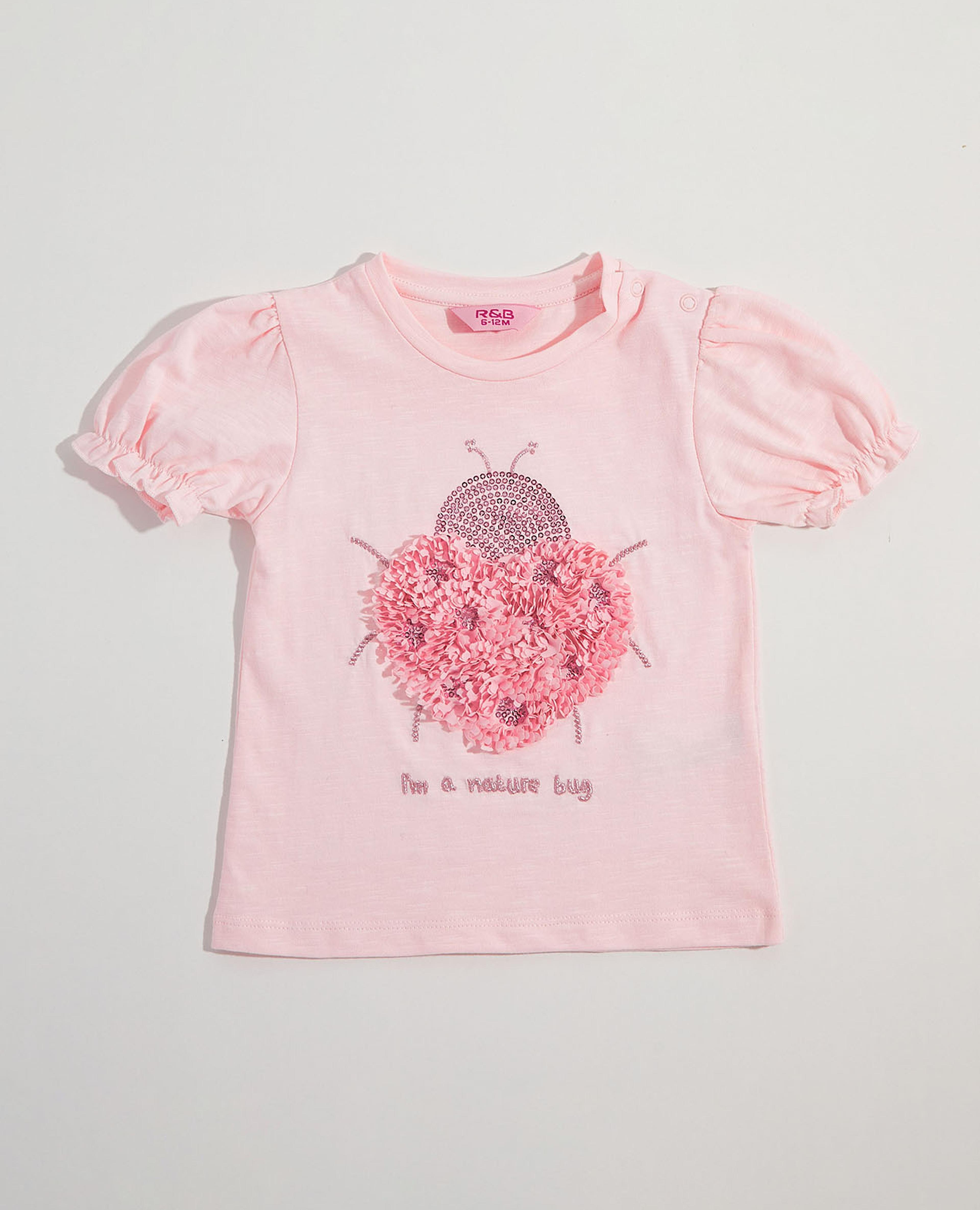 توب بطبعة جرافيك بياقة دائرية وأكمام منتفخة