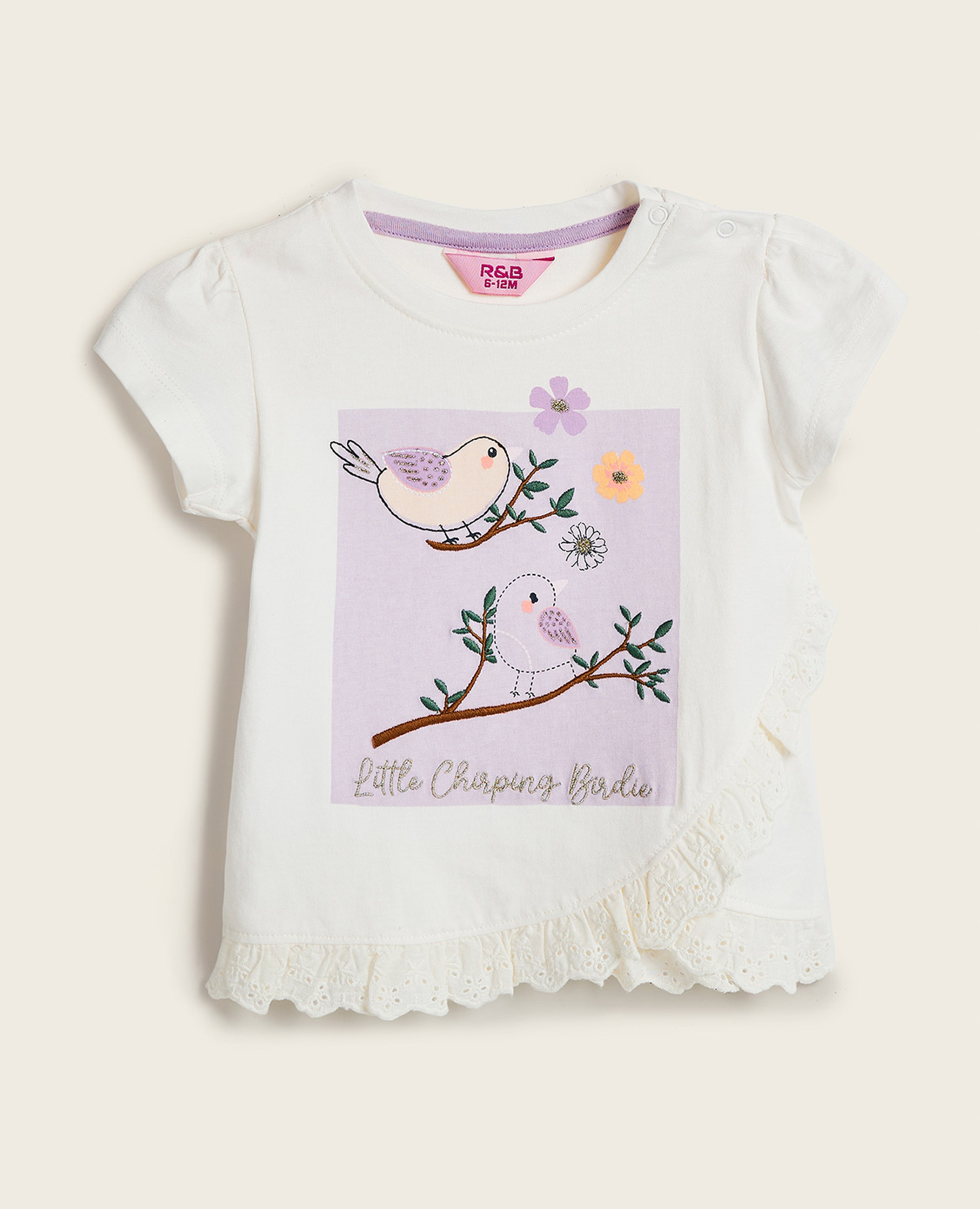 توب مطرز بياقة مستديرة وأكمام منتفخة