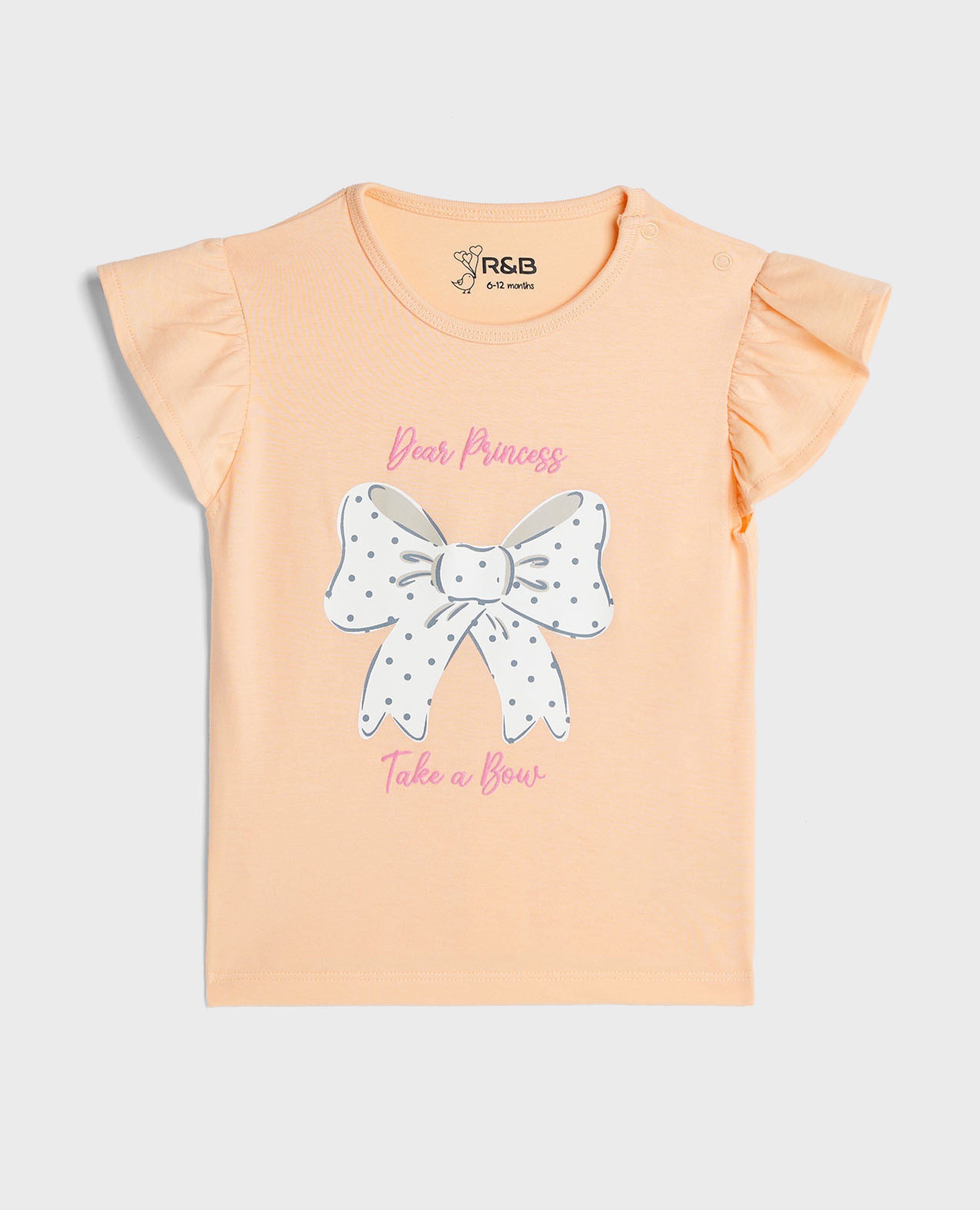 توب بطبعة بياقة مستديرة وأكمام واسعة