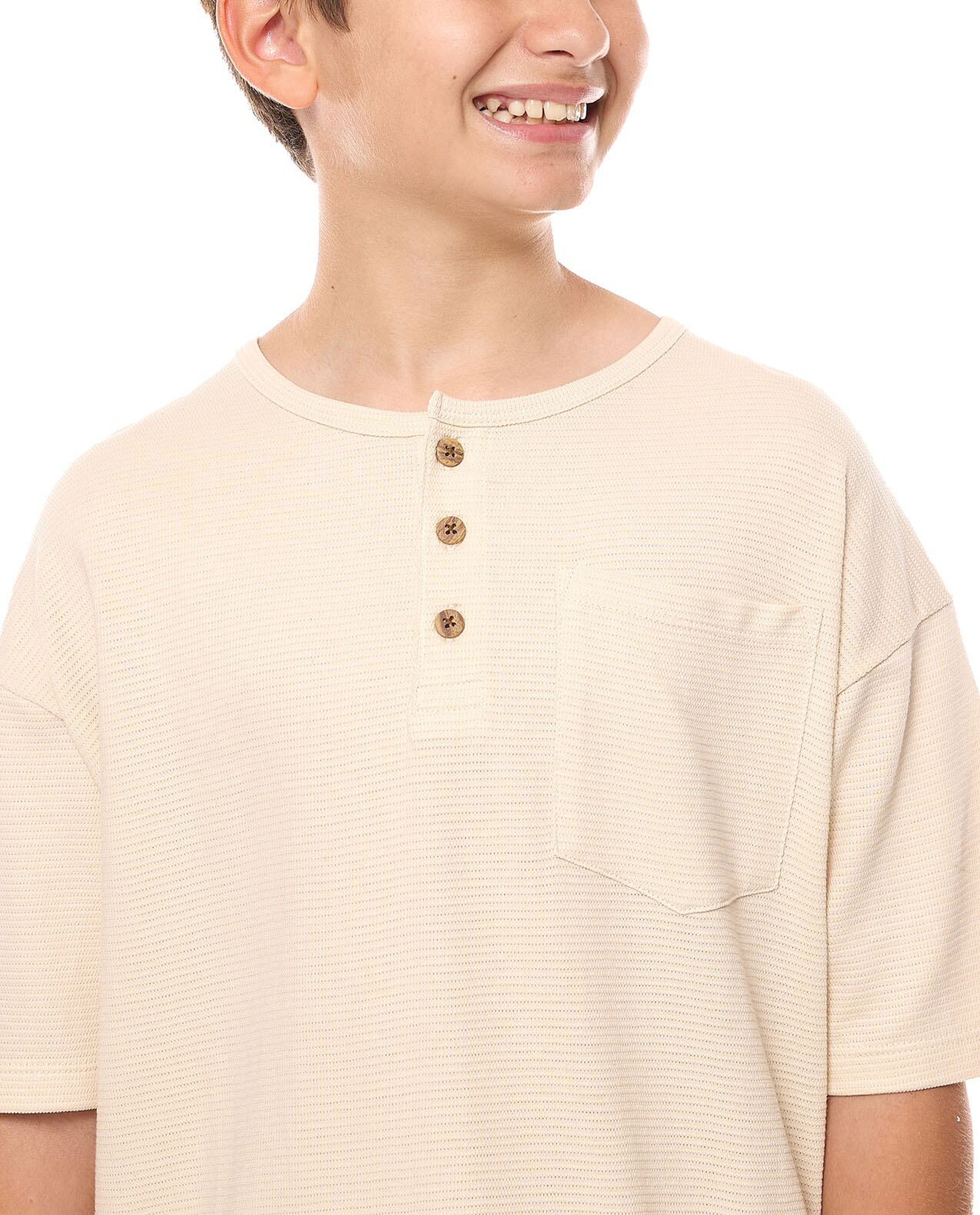Pocket Detail Oversized T-Shirt with Henley Neck and Short Sleeves