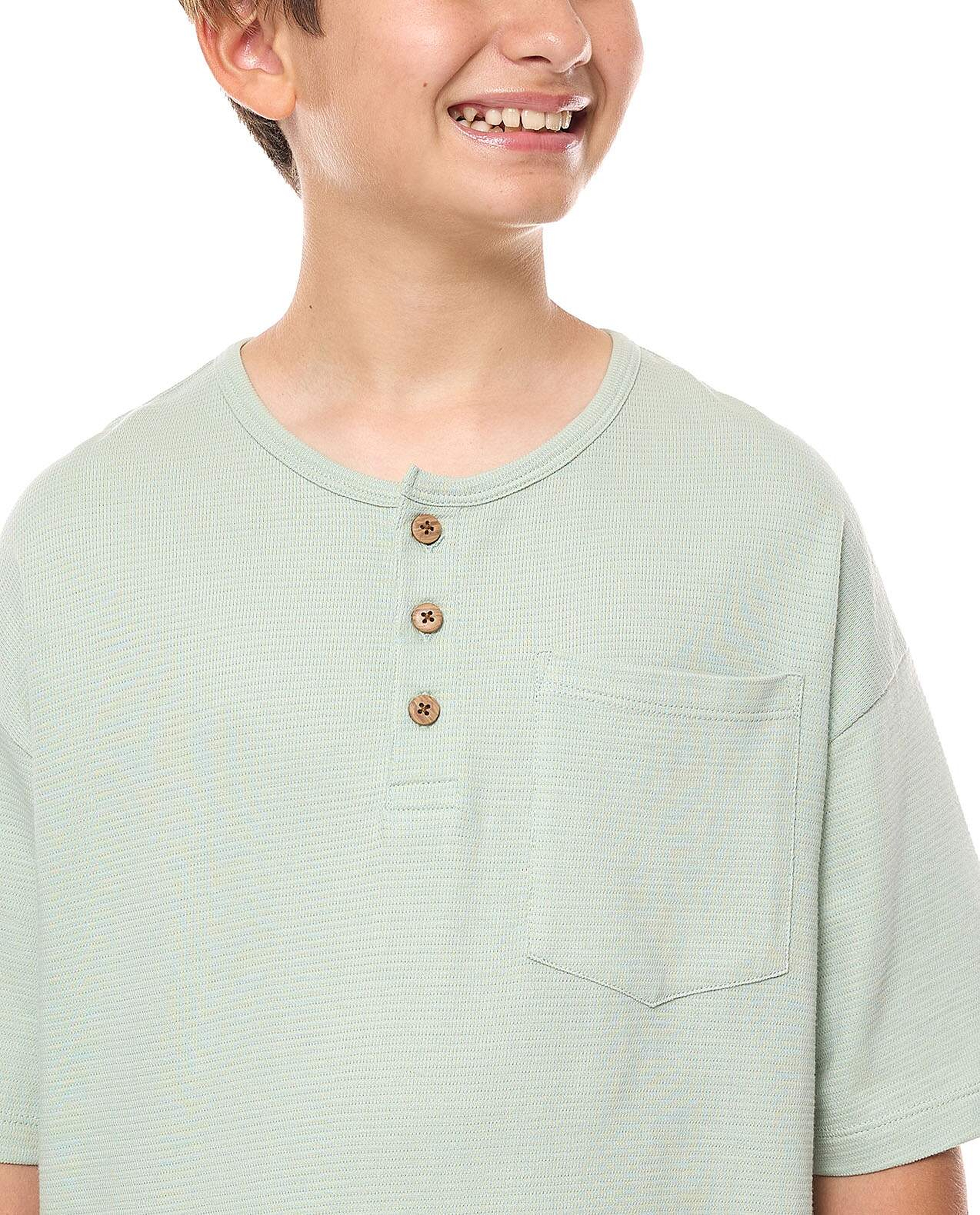 Pocket Detail Oversized T-Shirt with Henley Neck and Short Sleeves