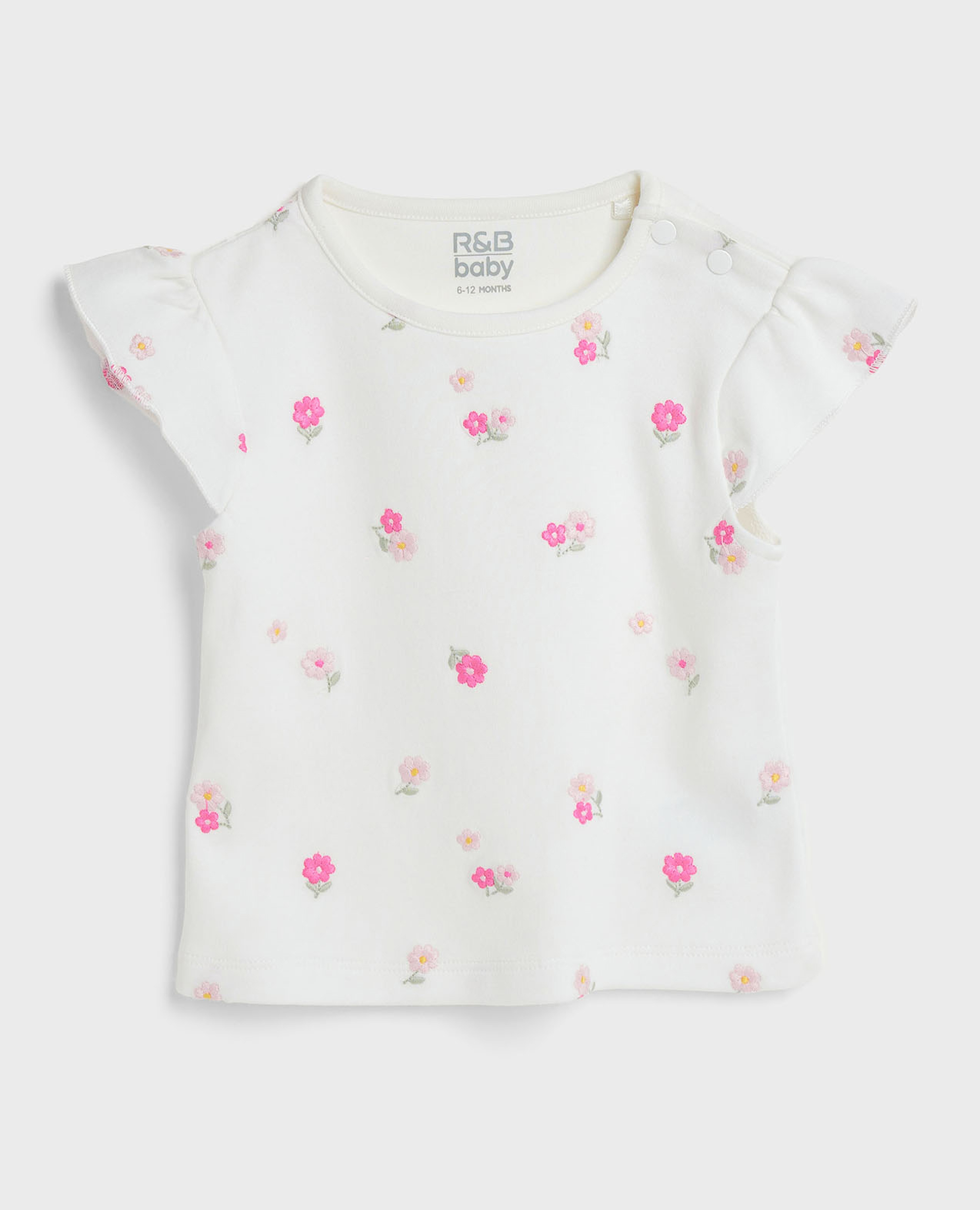 توب مطرز بياقة مستديرة وأكمام بكشكشة