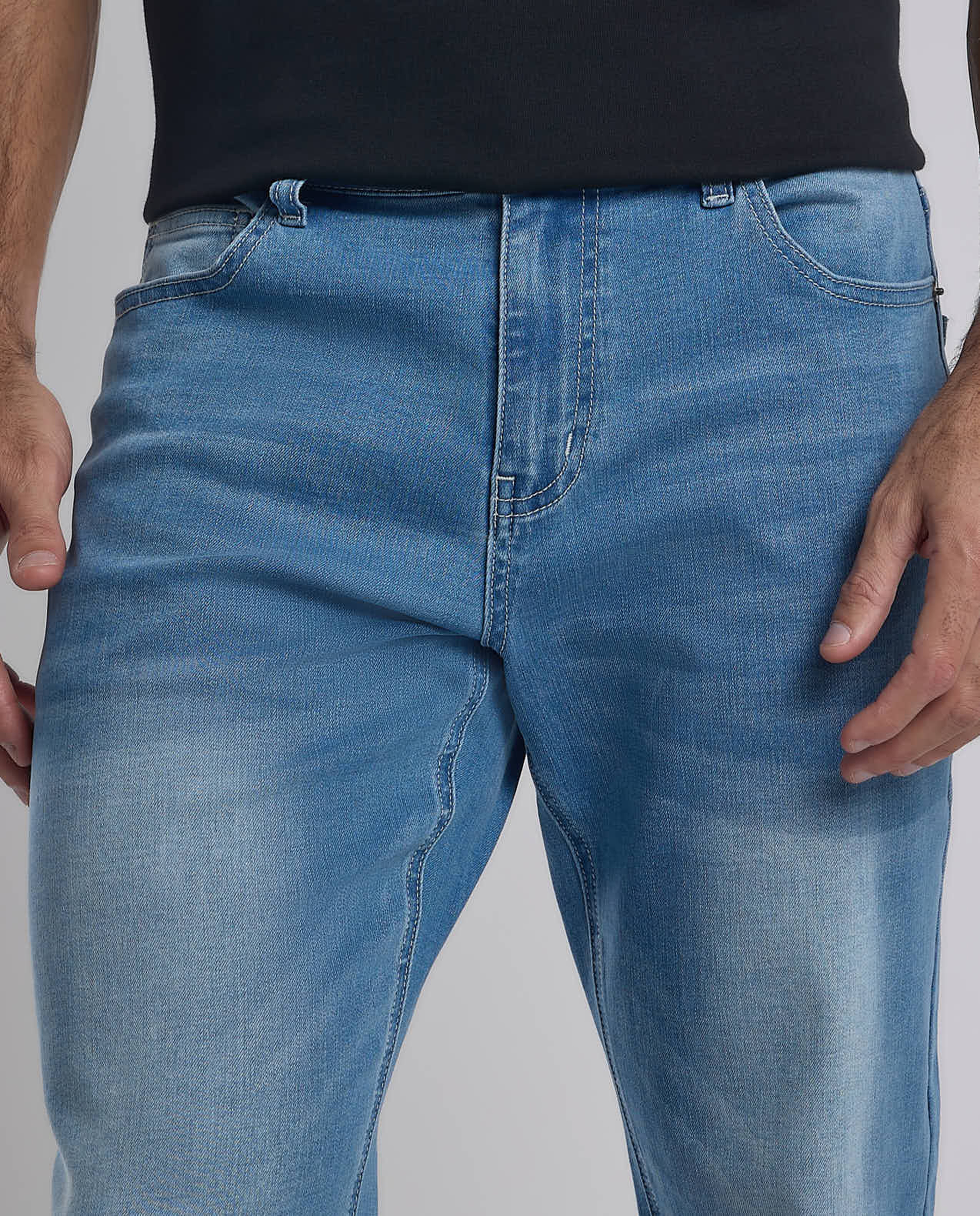 Faded Tapered Fit Jeans with Button Closure