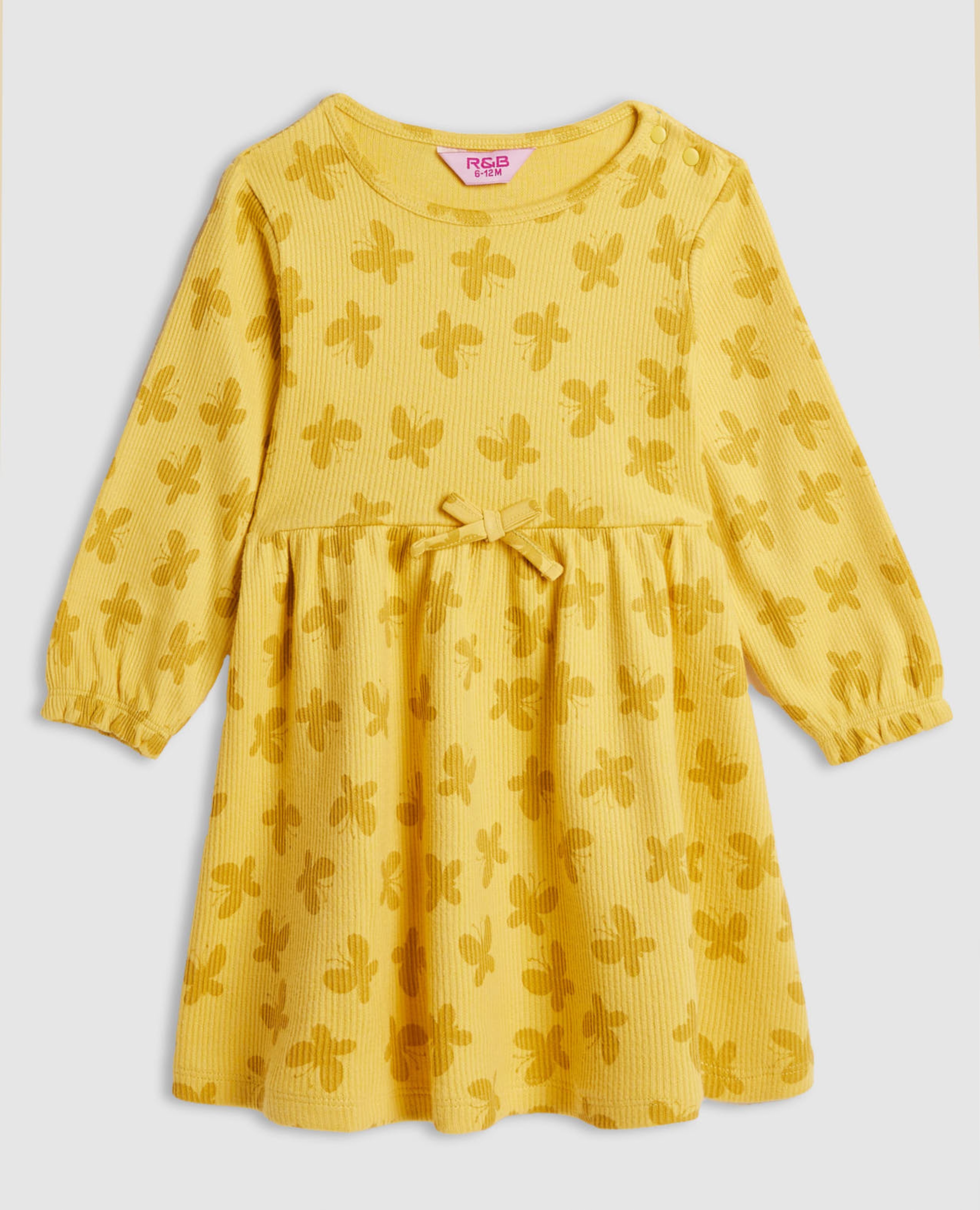 فستان مخصر بطبعة وأكمام طويلة