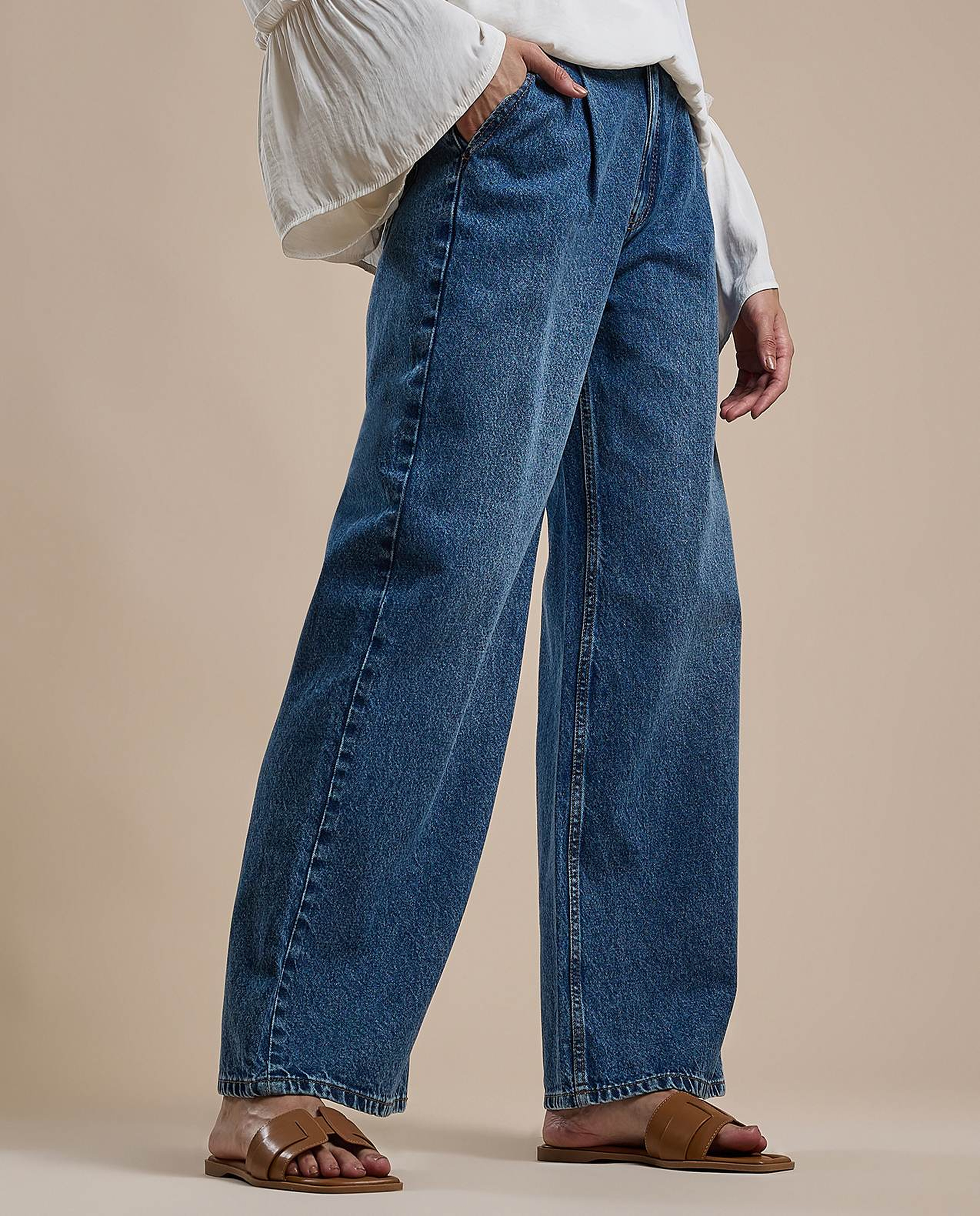 Washed Pleated Jeans with Button Closure