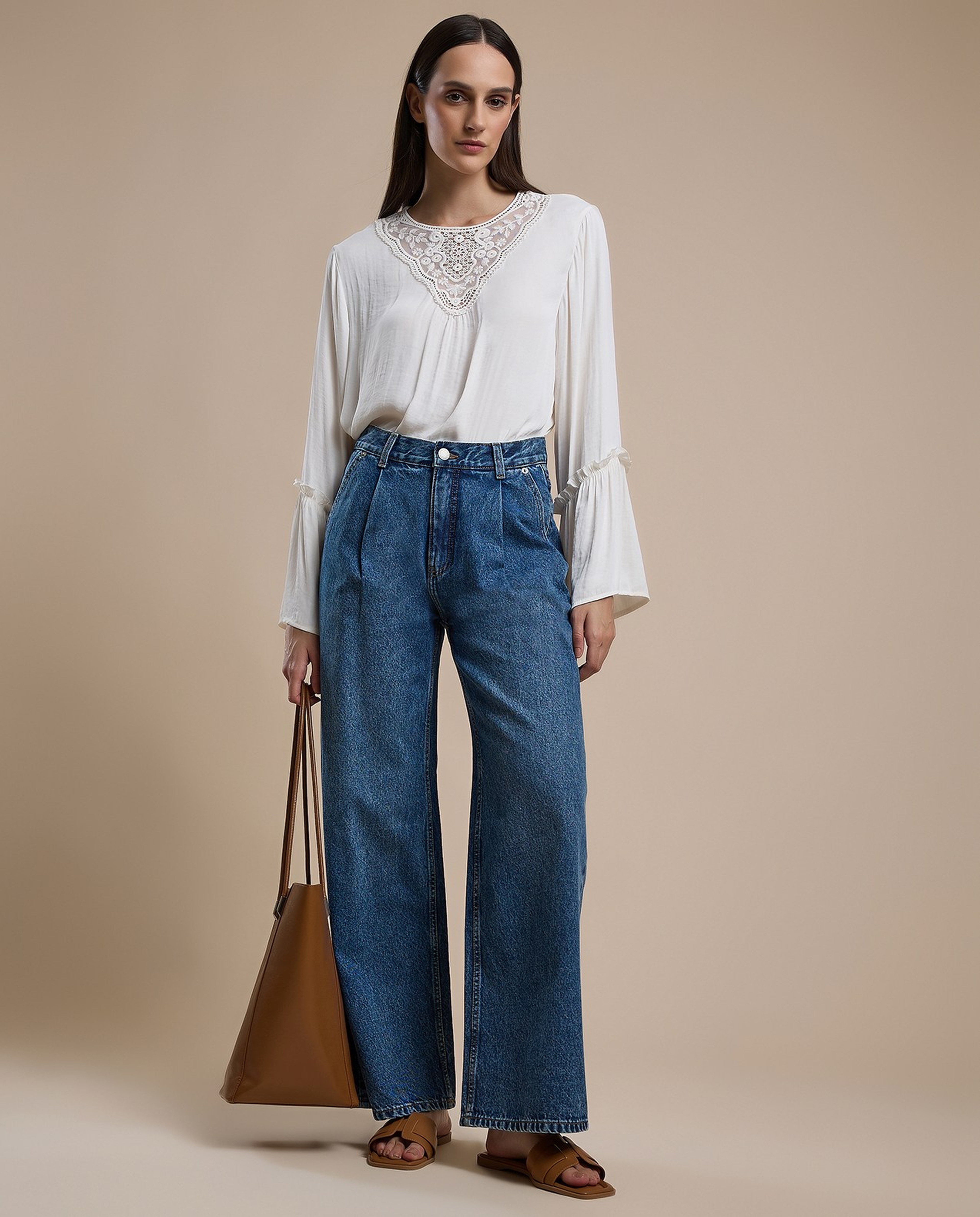 Washed Pleated Jeans with Button Closure