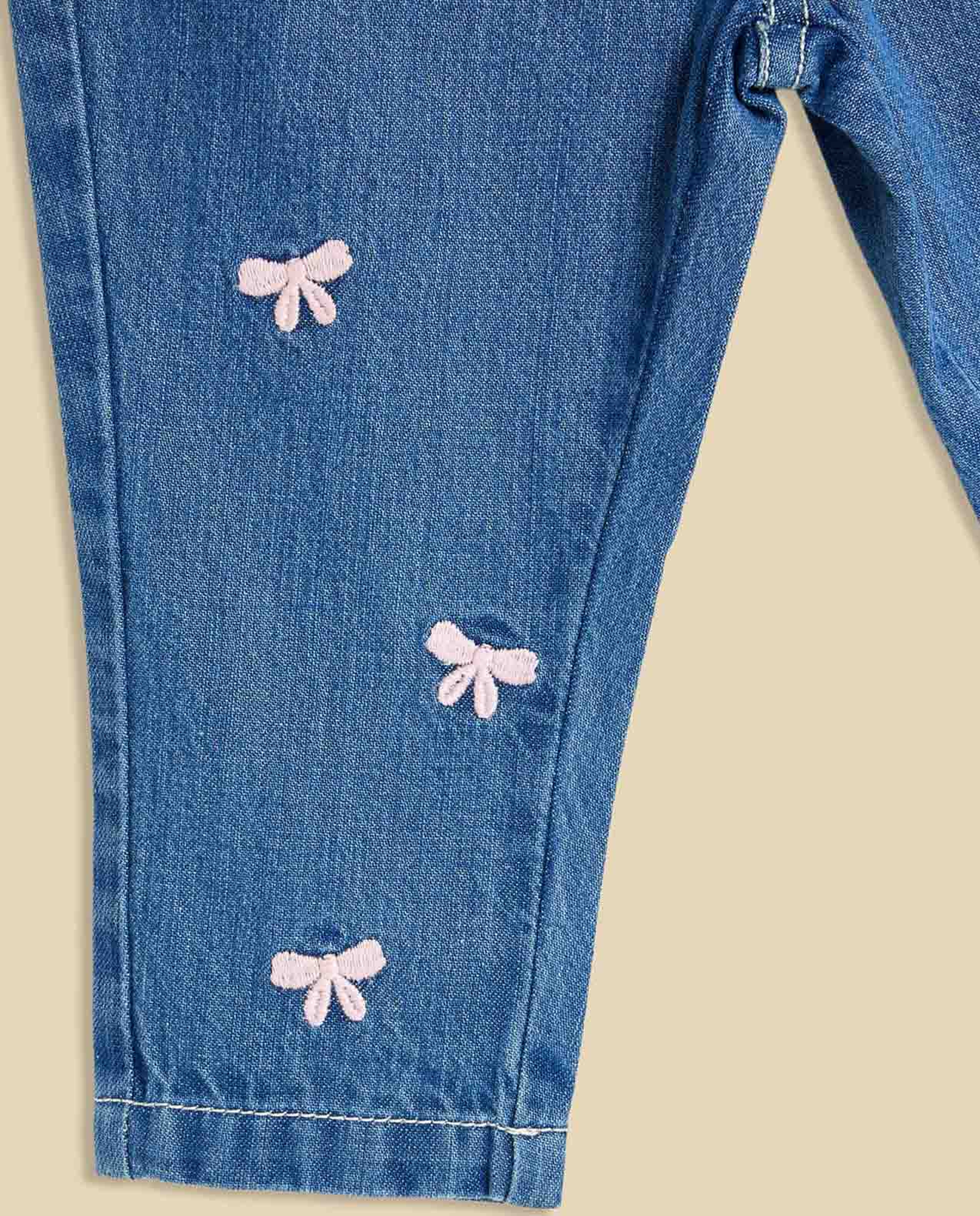 Bow Embroidered Jeans with Button Closure