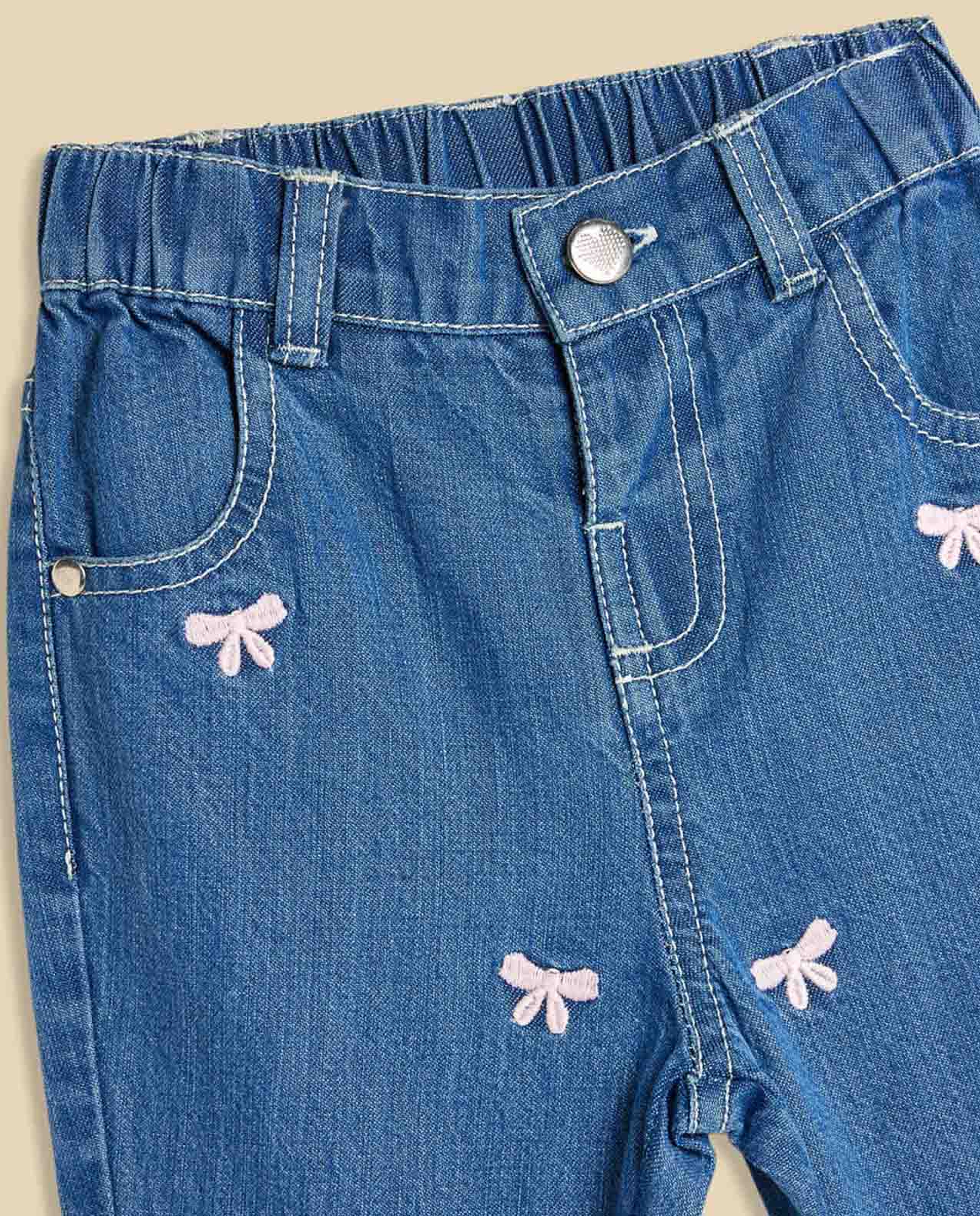 Bow Embroidered Jeans with Button Closure