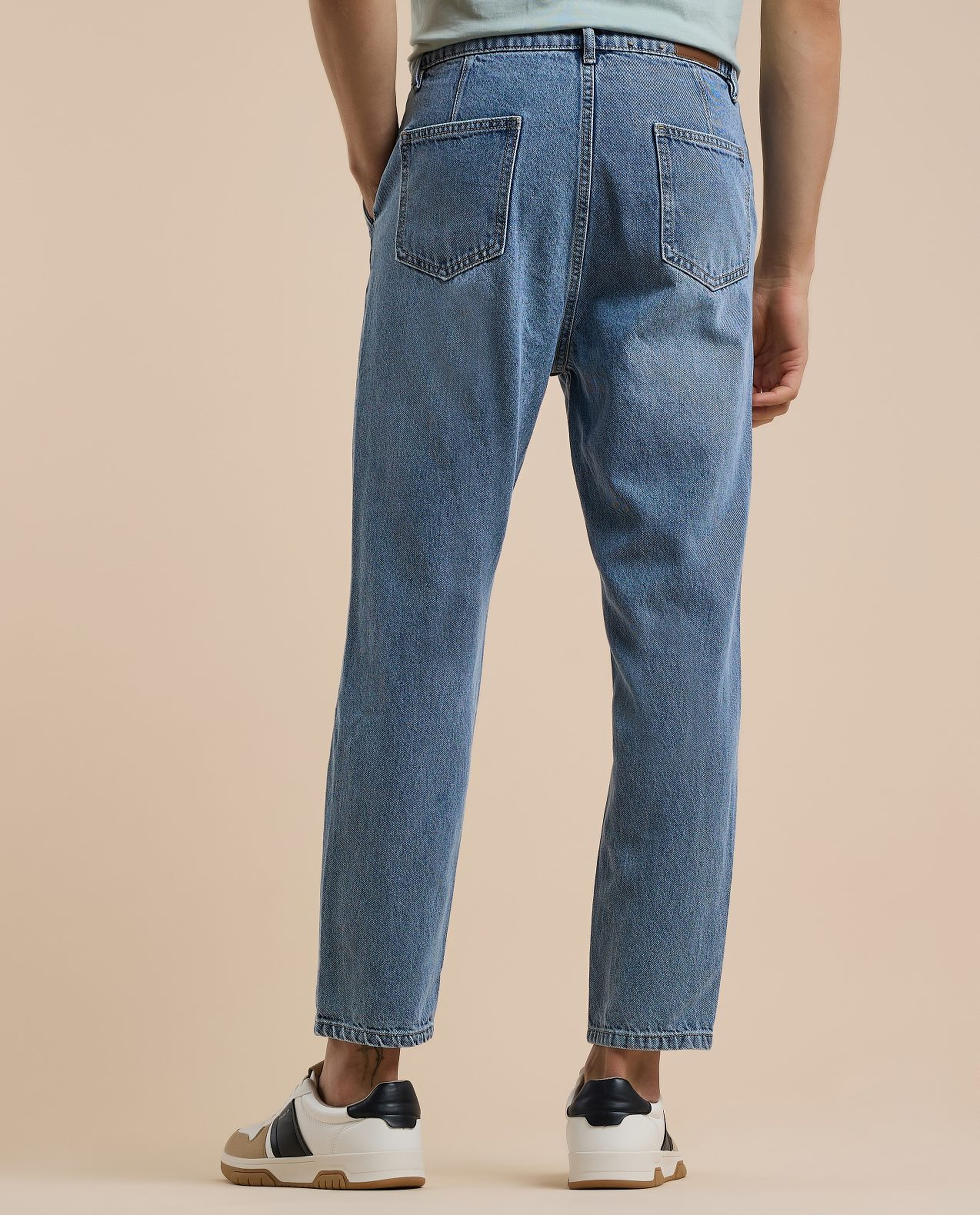 Washed Tapered Fit Jeans with Button Closure