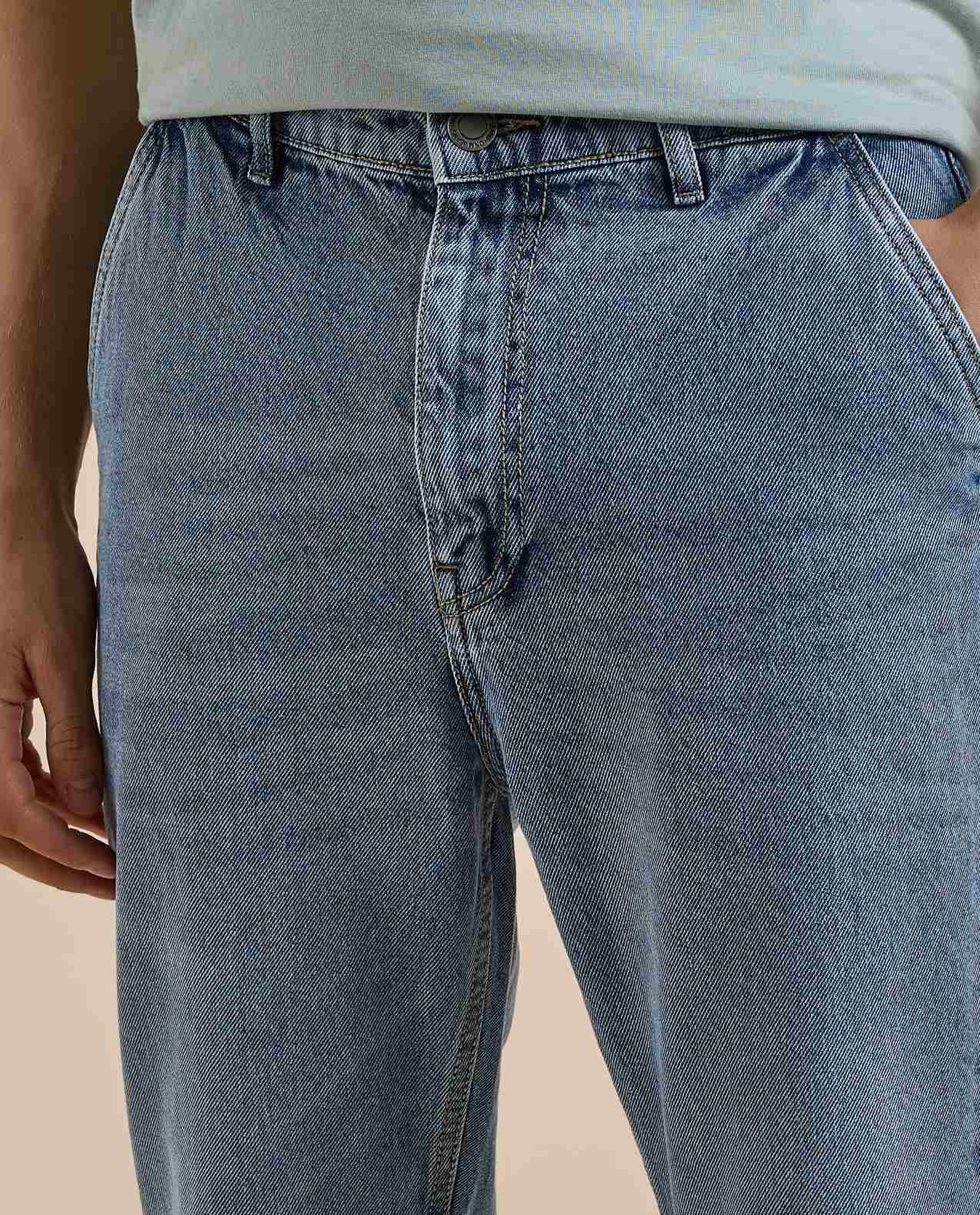 Washed Tapered Fit Jeans with Button Closure