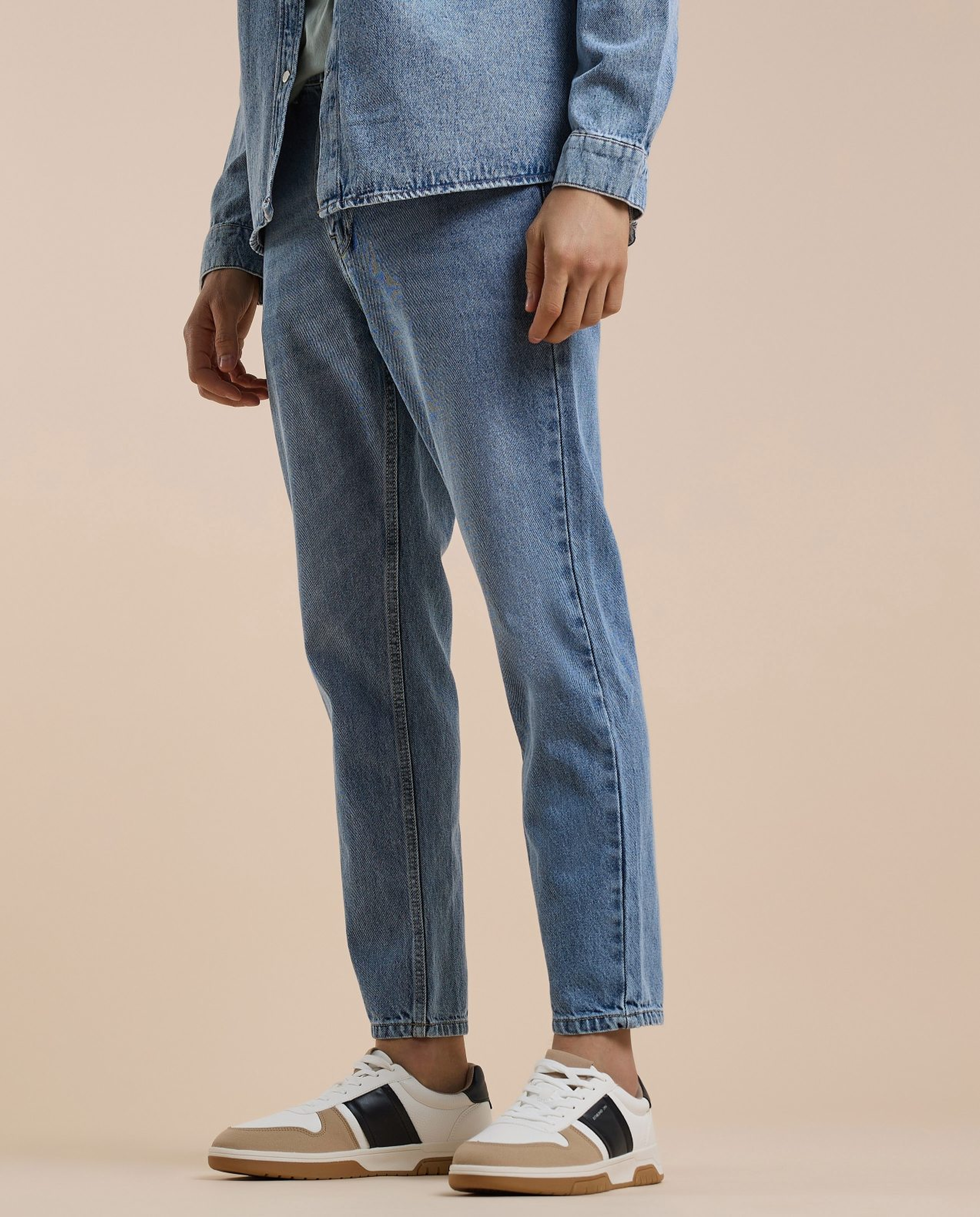 Washed Tapered Fit Jeans with Button Closure