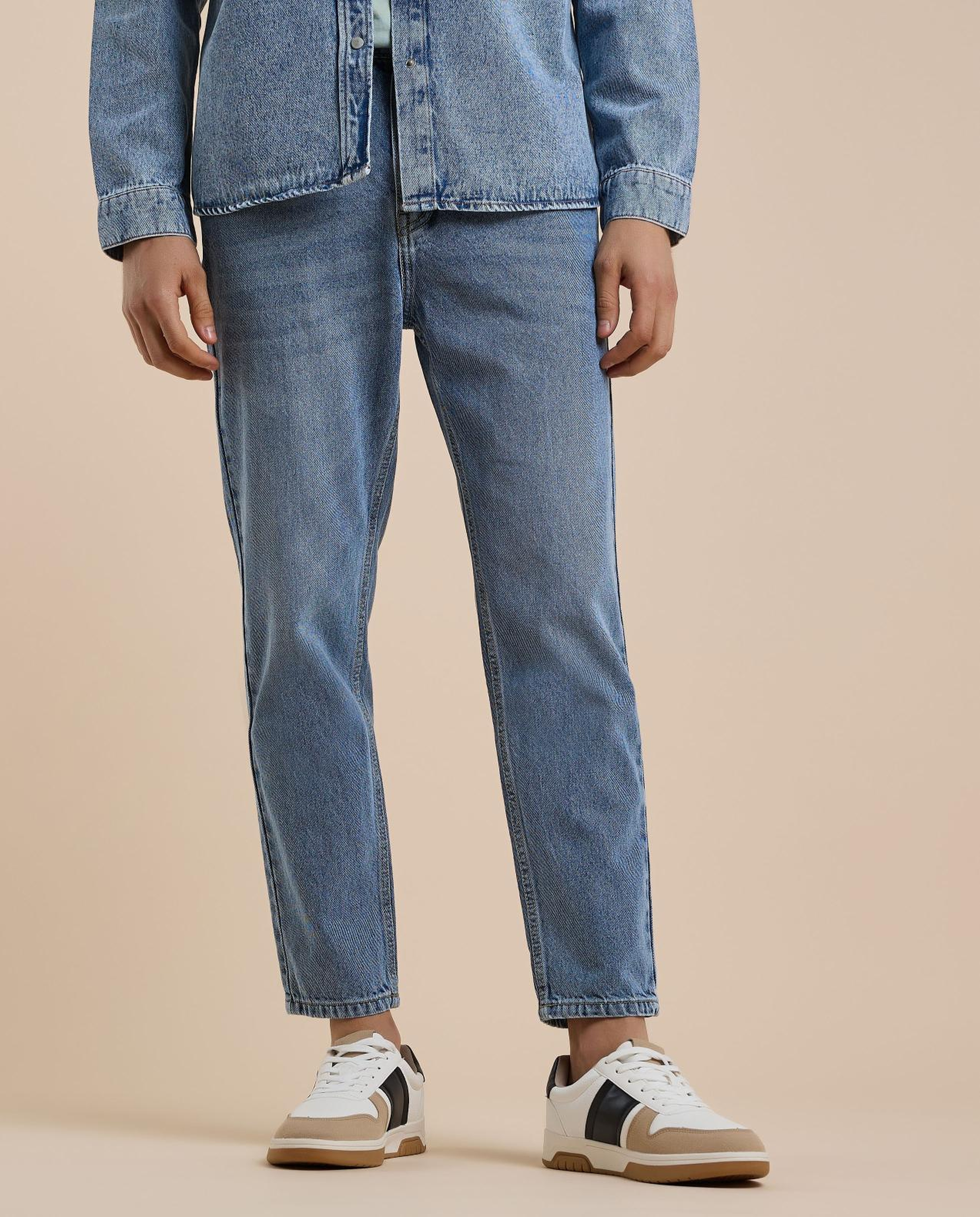 Washed Tapered Fit Jeans with Button Closure
